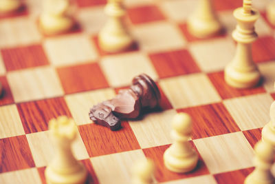 Close-up of chess pieces on table