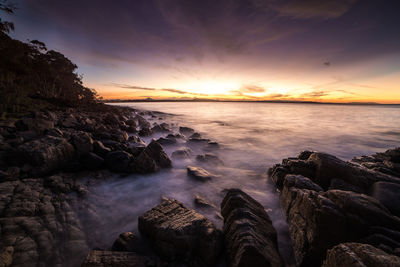 Scenic view of sea against sky during sunset