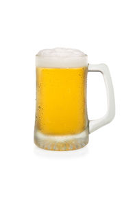 Close-up of beer glass against white background