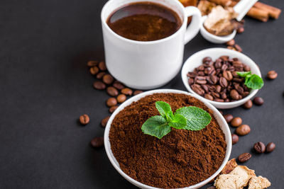 High angle view of coffee beans in bowl on table