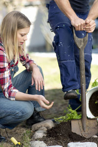 Young couple working in garden, stockholm, sweden