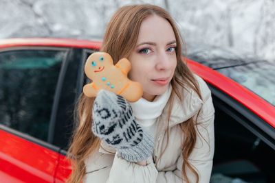 Portrait of smiling woman in car