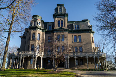 Low angle view of building against blue sky