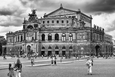 Group of people in front of historical building