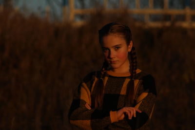 Portrait of teenage girl standing outdoors