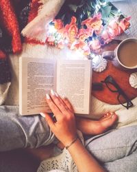 High angle view of woman reading book