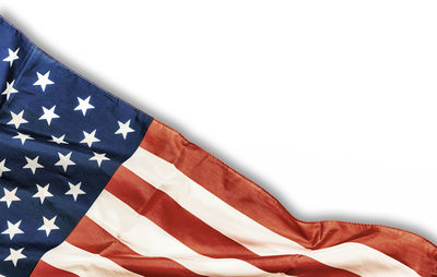 Close-up of american flag against white background