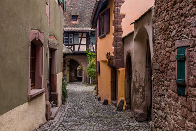 Narrow alley amidst buildings in town