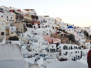 Houses in town against clear sky