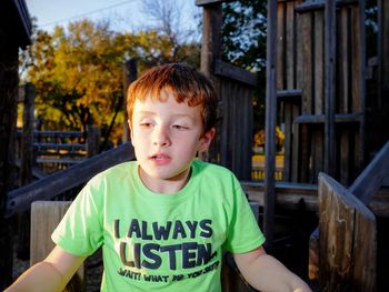 Close-up of boy on jungle gym at park