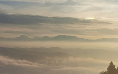 Scenic view of mountains against sky during sunset