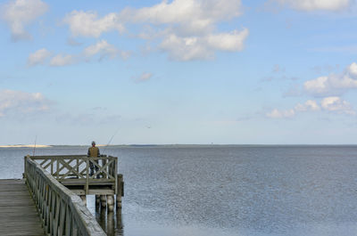 Pier over sea against sky