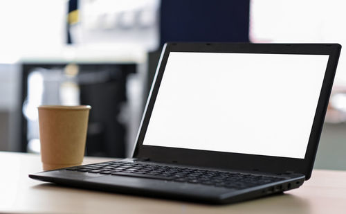 Close-up of laptop on table