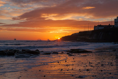 Scenic view of sea at sunset