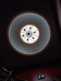 Low angle view of clock on ceiling in building