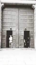 Woman standing in front of building