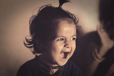 Close-up of happy girl at home