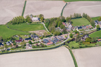 High angle view of agricultural field by houses