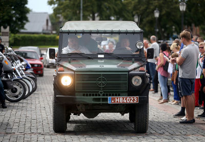 Rear view of people on street