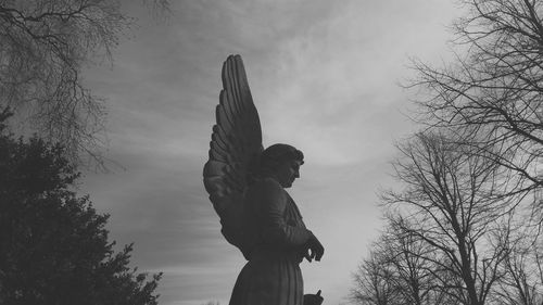 Low angle view of statue against sky