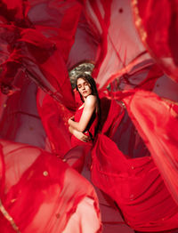 Full length of woman wearing red clothes