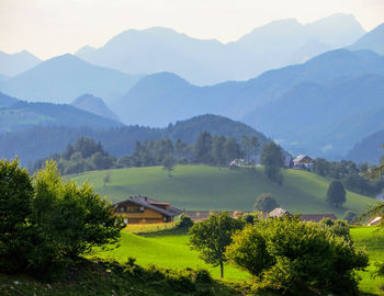 Scenic view of landscape and mountains against sky