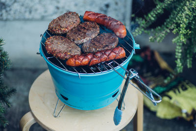 High angle view of meat on barbecue grill