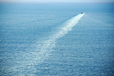 Mid distance view of boat moving in sea