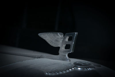 Close-up of guitar against black background