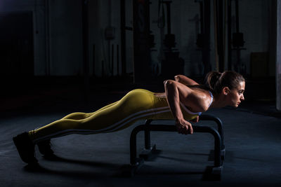 Side view of young woman lying on floor