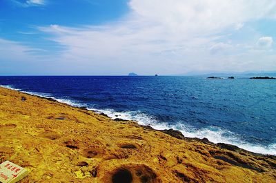 Scenic view of beach against sky