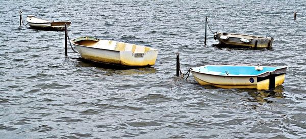 Boats moored in river