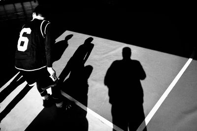 High angle view of people walking on road