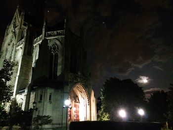 Low angle view of illuminated church against sky