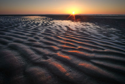 Scenic view of beach during sunset