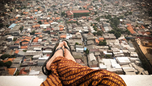 Low section of woman standing outdoors