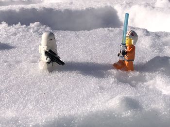 Toy car on snow covered land