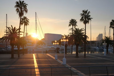Sea harbor with yachts at sunset. city landscape.