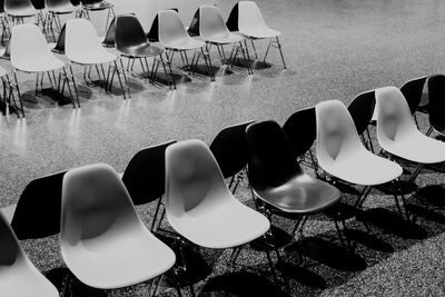 High angle view of chairs on table