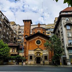 Buildings in city against sky