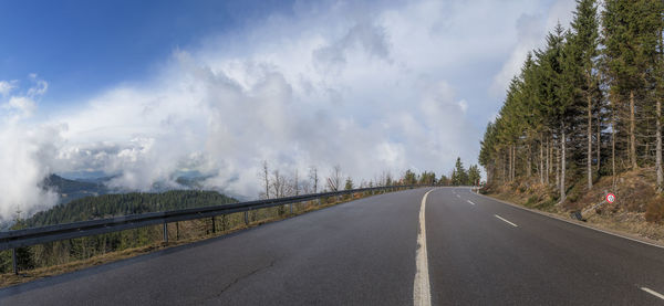 Empty road against sky