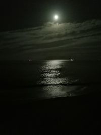 Scenic view of sea against sky at night