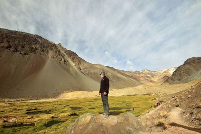 Rear view of man standing on mountain