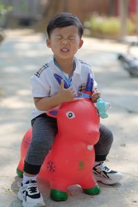 Portrait of boy playing with toy