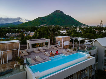 Scenic view of sea and mountains against sky