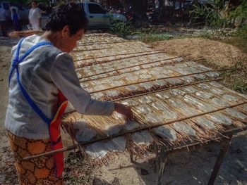 Man working on barbecue grill