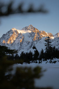 Scenic view of snowcapped mountains against sky during sunset