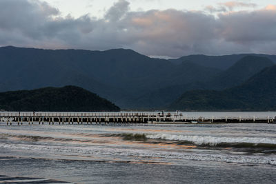 Scenic view of sea against mountains