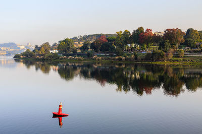 Rear view of man standing in lake