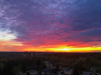 Scenic view of silhouette landscape against orange sky